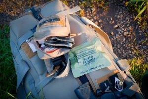 Emergency safety essentials on camping bag, essential car accessories