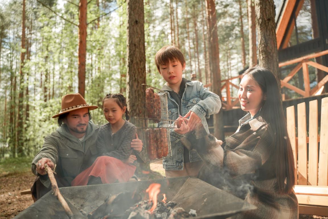 Family Camping Near Campfire